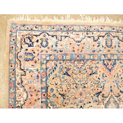 1384 - A Persian style rug with stylised floral design on a pale pink ground 201 x 148cm