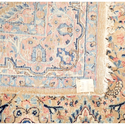 1384 - A Persian style rug with stylised floral design on a pale pink ground 201 x 148cm