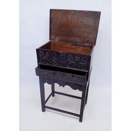 1388 - An 18th century oak bible box on integral stand with all over carved decoration, dated and monogramm... 