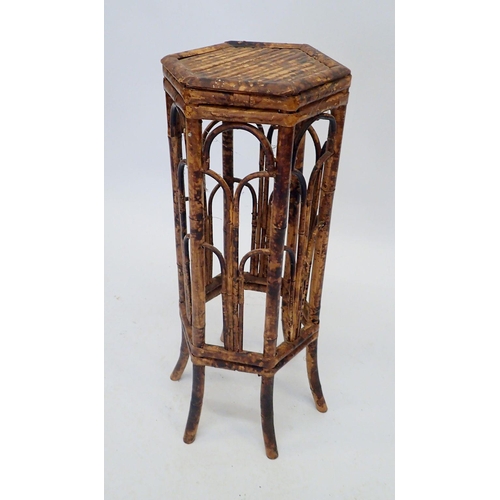 1398 - A 1920's bamboo octagonal plant stand, 25cm diameter