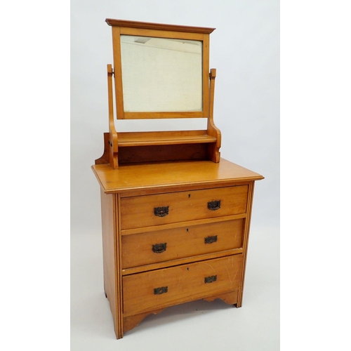 1406 - An Edwardian small satin walnut dressing table with swing mirror over three drawers, 78cm wide