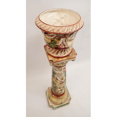 15 - A Capodimonte jardiniere and stand with moulded decoration 105cm tall