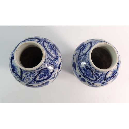 157 - A pair of Chinese blue and white baluster vases decorated birds, butterflies and flowers, four chara... 