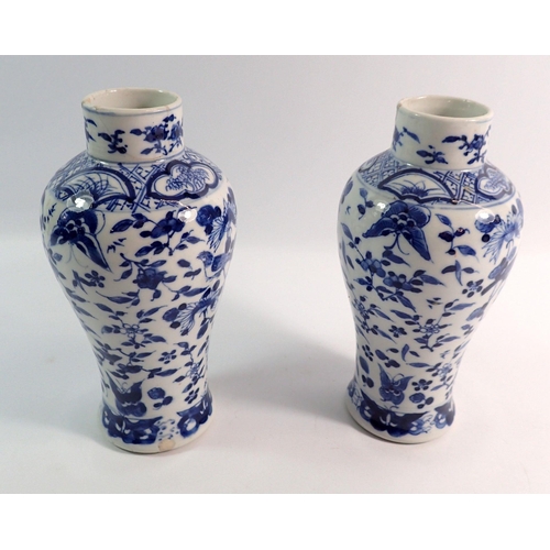 157 - A pair of Chinese blue and white baluster vases decorated birds, butterflies and flowers, four chara... 