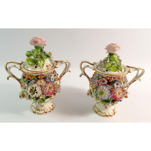 185 - A pair of 19th century Rockingham Style floral encrusted pot pourri vases and covers, 15cm tall