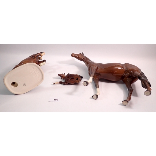 199 - A large Beswick brown horse, 28.5cm tall, a rearing horse No. 1014 and a foal No 915