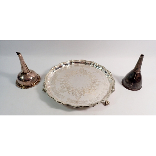 244 - A Victorian silver plated salver, 25cm diameter and two Sheffield plate wine funnels