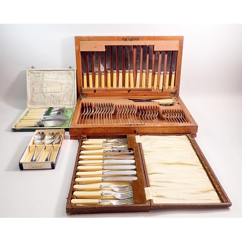 256 - A silver plated cutlery set in oak case, two sets of fish cutlery etc.