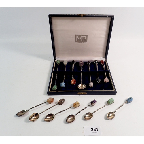 261 - A set of twelve stone mounted picks and spoon plus six stone mounted spoons