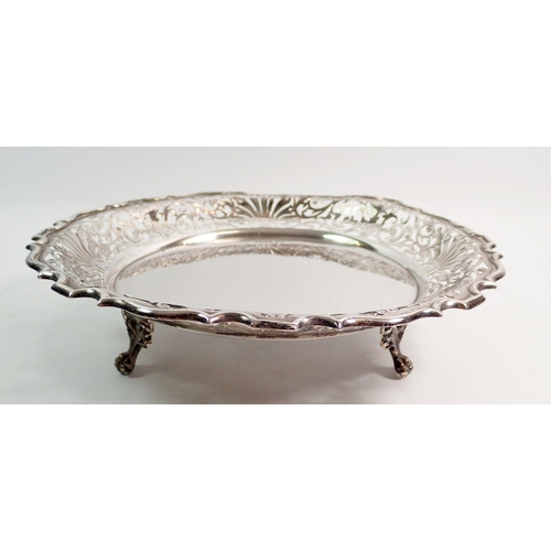 273 - An Edwardian silver circular tray with pierced border decoration on three feet by Walker & Hall Shef... 