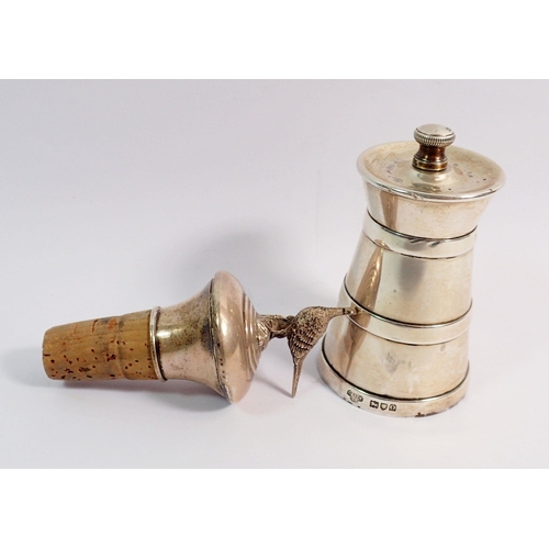 283 - A silver pepper grinder London 1909 and a silver filled bottle stopper with pheasant finial Birmingh... 