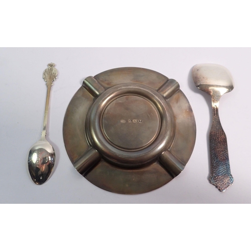 315 - A silver presentation ashtray, a silver spoon, 150g and a silver plated spoon