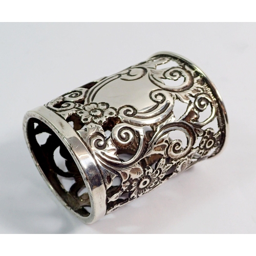 337 - A silver pierced and embossed napkin ring, Birmingham 1899, 6.7cm tall, 29g