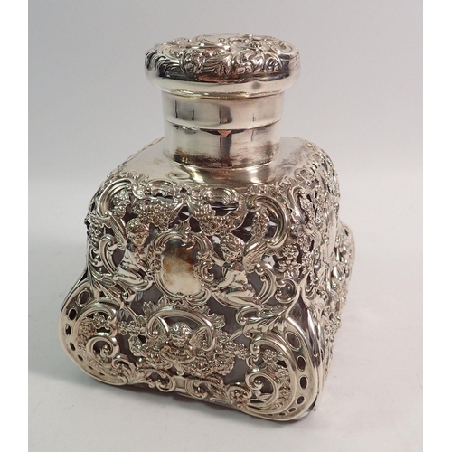 340 - A large silver clad glass scent bottle or ink well with cherub and floral decoration, 13cm tall, Lon... 