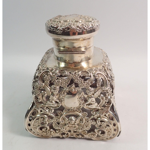 340 - A large silver clad glass scent bottle or ink well with cherub and floral decoration, 13cm tall, Lon... 