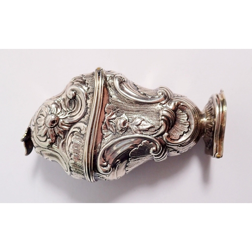 342 - An antique continental silver box with scrollwork and leaf decoration, the base with small hinged co... 