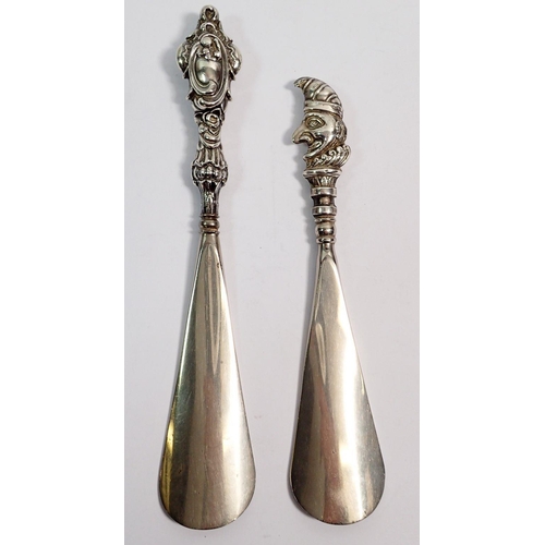 348 - A silver handled Punch shoe horn, Birmingham 1907 by S & Co and another silver handled shoe horn