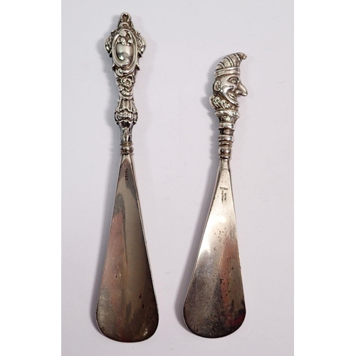 348 - A silver handled Punch shoe horn, Birmingham 1907 by S & Co and another silver handled shoe horn