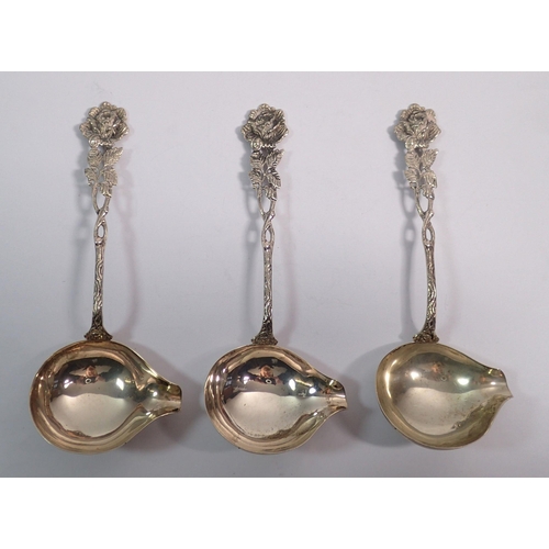 349 - Three silver or white metal Maltese sauce ladles with rose terminals, 15cm, 83g