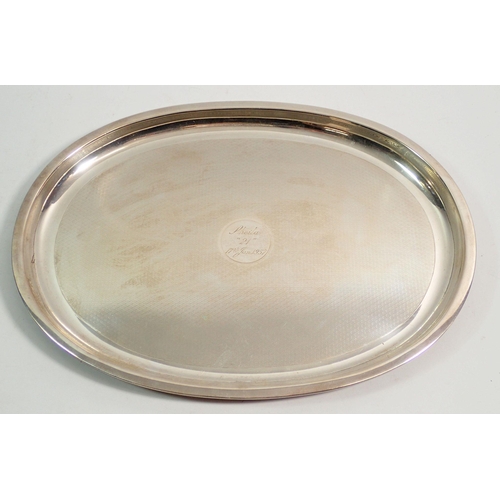 350 - An oval silver salver engraved and dated 1957, 27cm wide, 457g