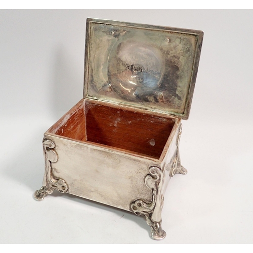 352 - An Arts & Crafts silver trinket box in the form of a casket with strap hinges and hoof feet, 11 x 8c... 