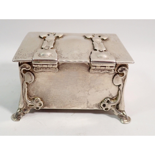 352 - An Arts & Crafts silver trinket box in the form of a casket with strap hinges and hoof feet, 11 x 8c... 