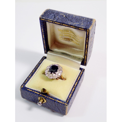 362 - An 18 carat gold sapphire and diamond cluster ring, sapphire 8 x 6mm, size N, 5.2g - boxed