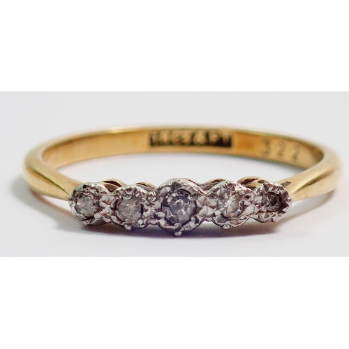 364 - An 18 carat gold ring set five graduated diamonds with original receipt, size M to N, 2g