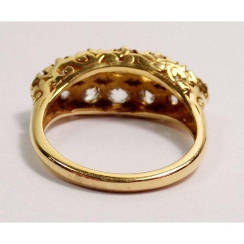 366 - An 18 carat gold ring set double row of twelve graduated diamonds, largest stones 4mm, size N, 5.3g