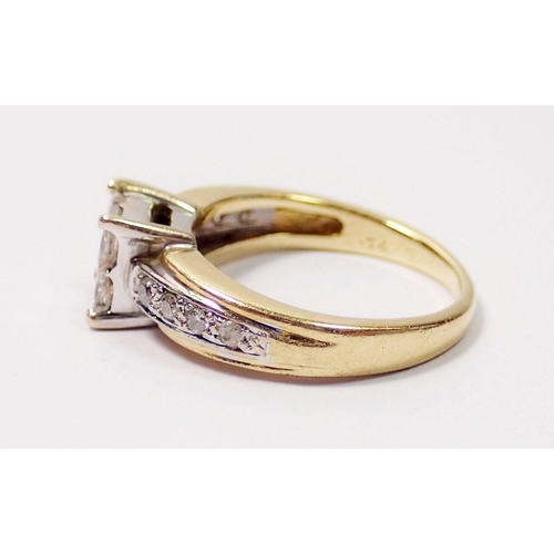 372 - An 18 carat gold invisible set princess cut diamond ring with round brilliant cut diamond set should... 