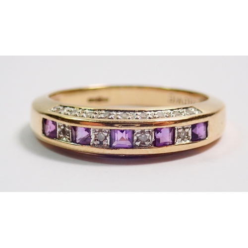 373 - A 9 carat gold ring channel set amethysts and diamonds on a diamond set band, size L-M, 2.5g