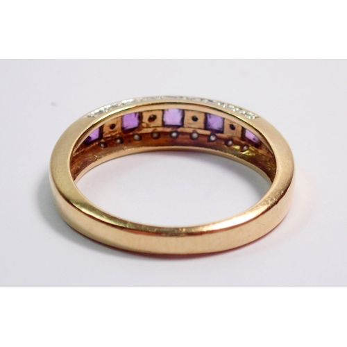 373 - A 9 carat gold ring channel set amethysts and diamonds on a diamond set band, size L-M, 2.5g