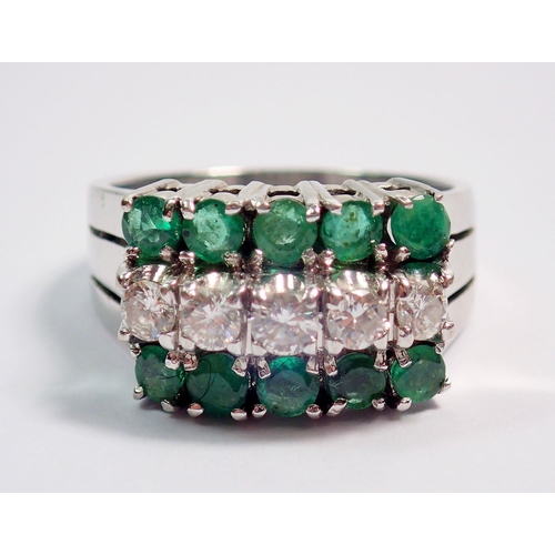 374 - A 14k white gold ring set five diamonds flanked by ten emeralds, size N, 6.8g