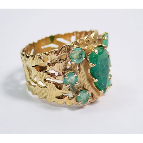 377 - A gold ring set pear cut emerald and six smaller emeralds, size O to P, 6.1g, unmarked but tested as... 