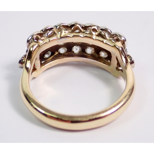 380 - A gold ring (unmarked) set three rows of seven diamonds, size N to O, 6g