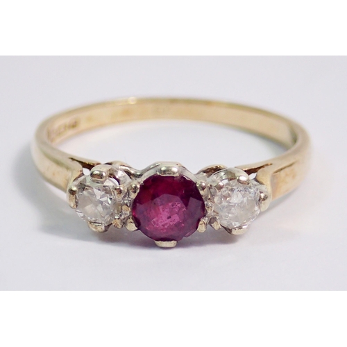 382 - A 9 carat gold ring set ruby flanked by two diamonds, size Q to R, 2.3g