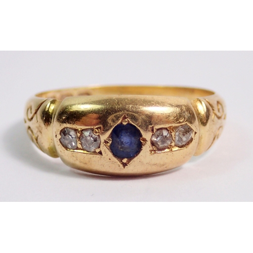 387 - An 18 carat gold Victorian ring set sapphire flanked by two diamonds, size L, 3.8g