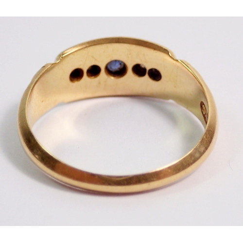 387 - An 18 carat gold Victorian ring set sapphire flanked by two diamonds, size L, 3.8g