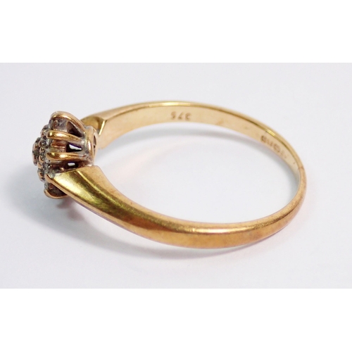 393 - A 9 carat gold diamond cluster ring, size K, 1.8g