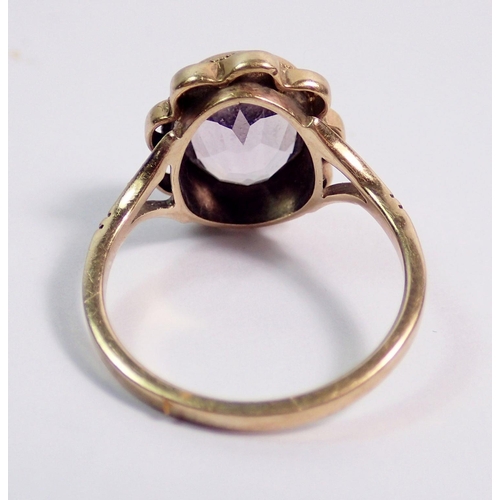 395 - A 9 carat gold oval cut amethyst ring, size J to K, 2.5g