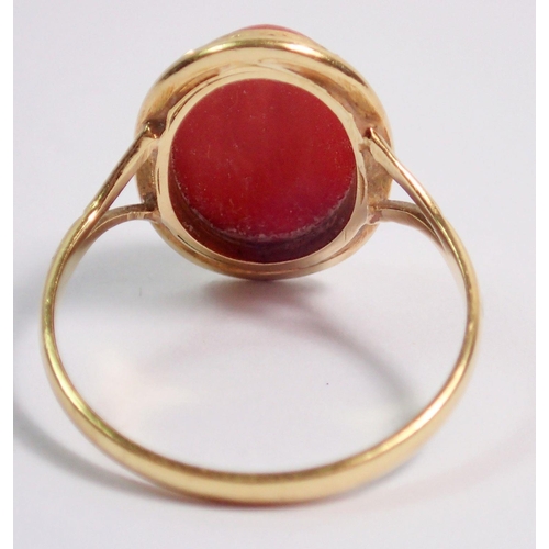 397 - An 18 carat gold coral set ring, size N, 2.6g