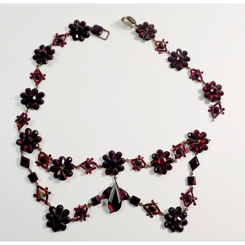 410 - A Victorian Vauxhall glass necklace with floral cluster and geometrical links, in need of repair