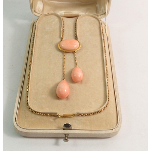 411 - A fine Italian gold negligee necklace set oval coral plaque with two coral asymmetrical pear cut dro... 