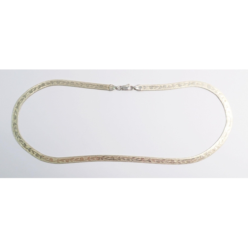 415 - An 18 carat white gold knitted necklace with etched leaf decoration 14.1g, 45cm