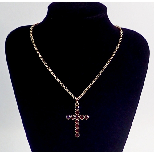 416 - An antique yellow metal and garnet set crucifix on 9 carat gold chain, chain 5.8g - total weight 8.8... 