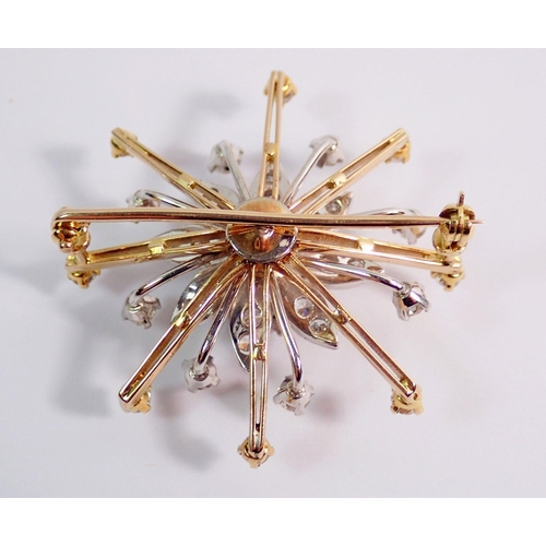 430 - A fine quality yellow and white gold star burst brooch set diamonds, 4cm diameter, 14.8g (unmarked)