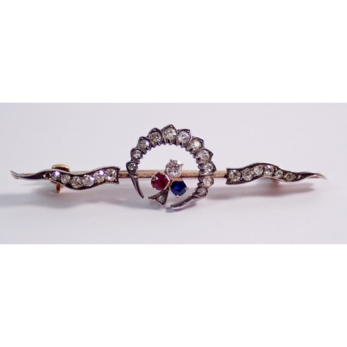 431 - An antique yellow and white metal crescent brooch set diamonds, with diamond, ruby and sapphire tref... 