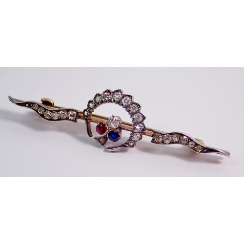 431 - An antique yellow and white metal crescent brooch set diamonds, with diamond, ruby and sapphire tref... 