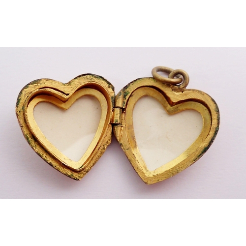 441 - A 9 carat gold front and back small heart form locket, 2.3g