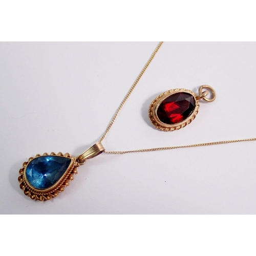 443 - An Edwardian 9 carat gold pendant necklace set blue topaz, 1.6g and a 9 carat gold pendant set garne... 